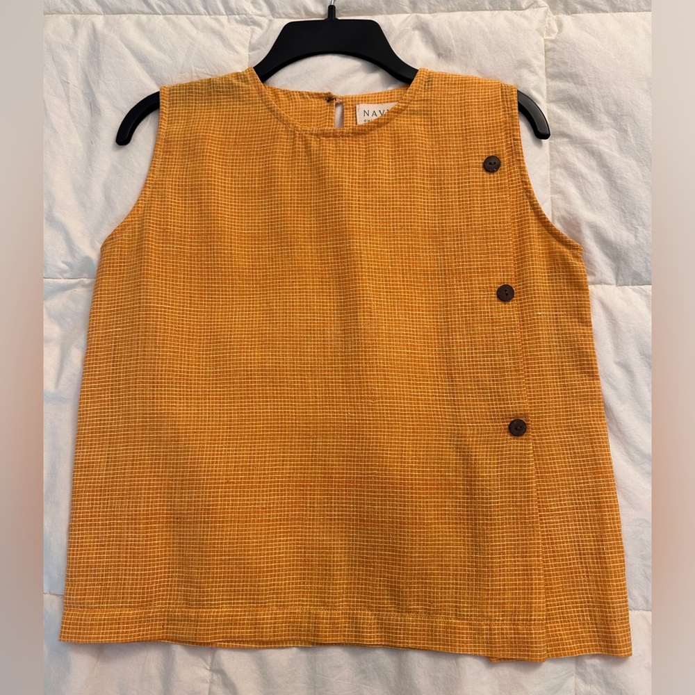 Mustard yellow/ orange linen sleeveless top with coconut shell button detail.